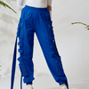 Model wearing vibrant blue sweat pants with side zippers, made from soft breathable fabric, front view