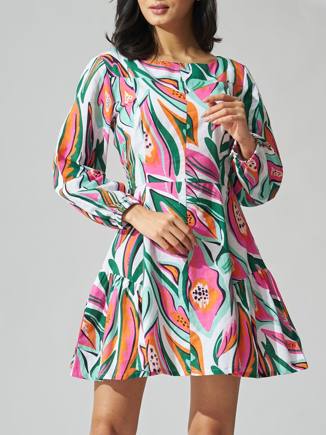 Women's floral print dress in vibrant colors featuring puff sleeves and a flared skirt, now on sale