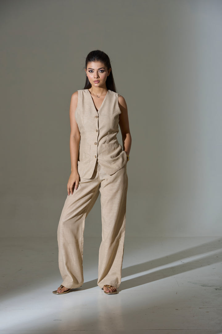 Model wearing a beige sleeveless V neck Waist coat and pants