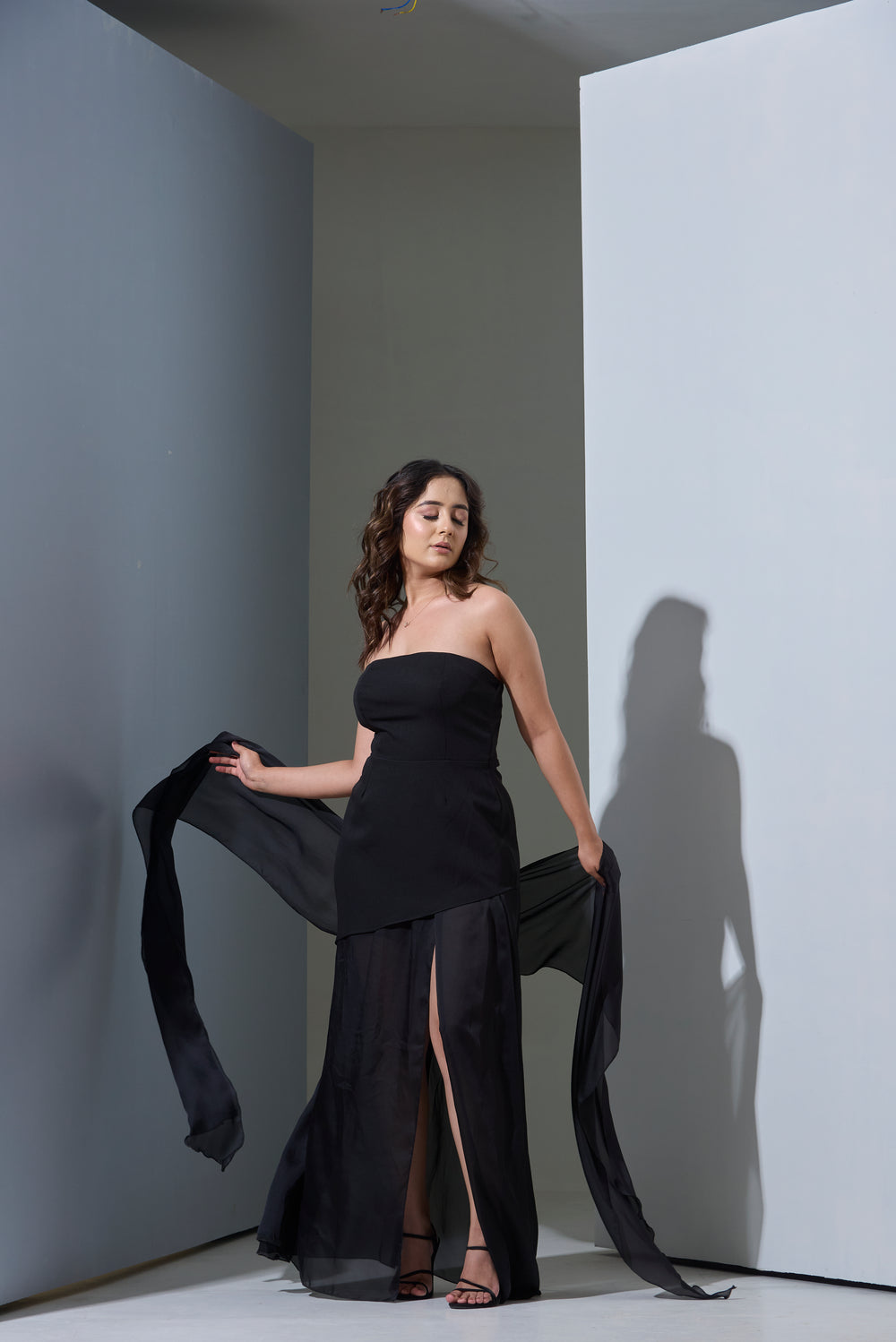 Woman in a black strapless gown with Chiffon Satin Stole