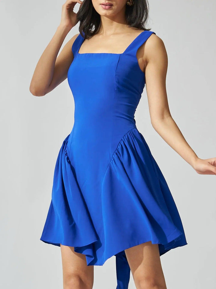Risate backless bow mini dress in vibrant blue with a flared skirt and square neckline