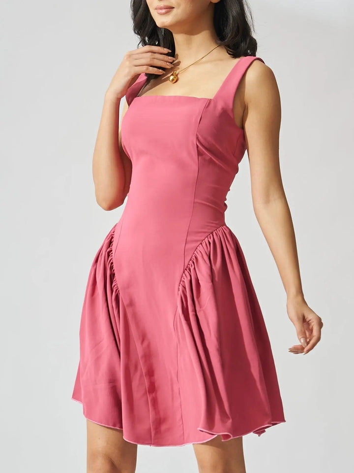 Risate backless bow mini dress in pink with elegant design and playful silhouette