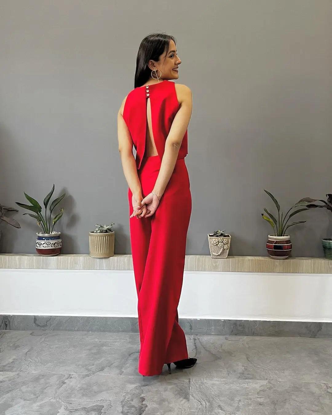 Elegant woman in a red outfit showcasing a black co-ord set for women with stylish details