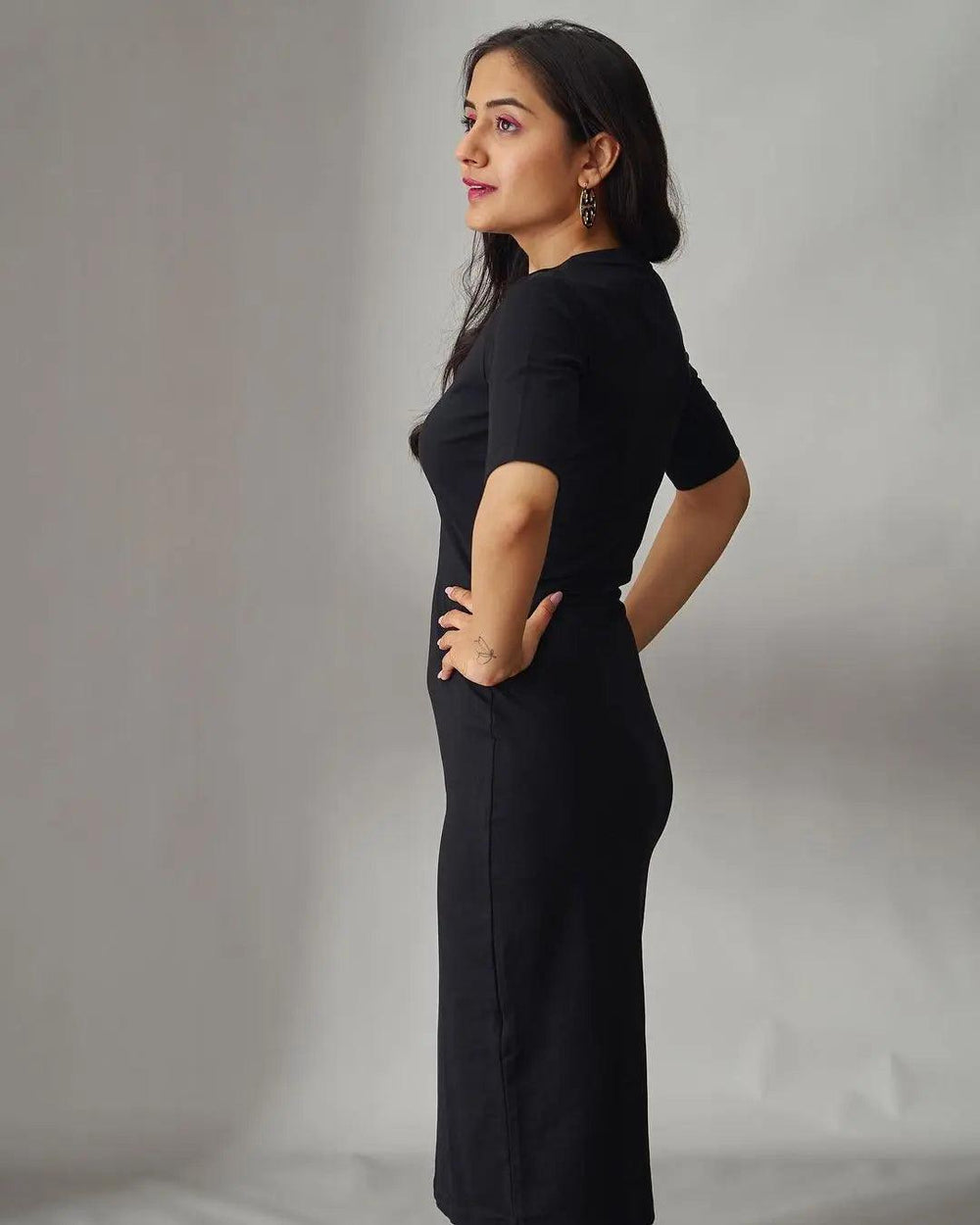 Risate black midi bodycon dress featuring a fitted silhouette and sleek design for a stylish look