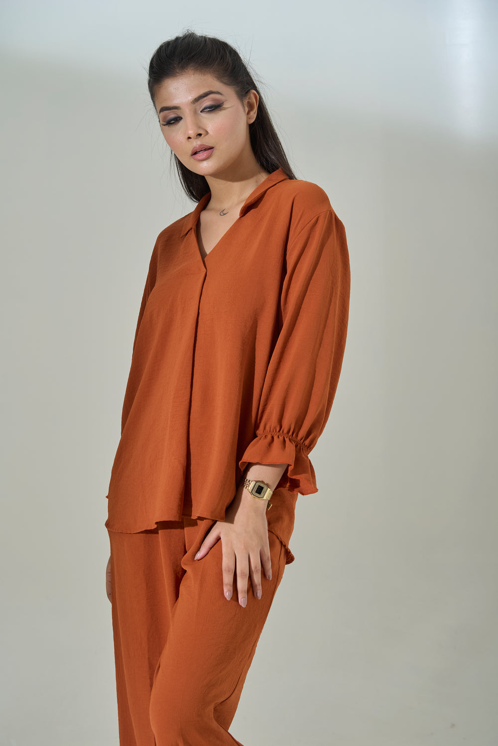 Burnt orange crepe coord set featuring a stylish blouse and matching pants, ideal for casual wear