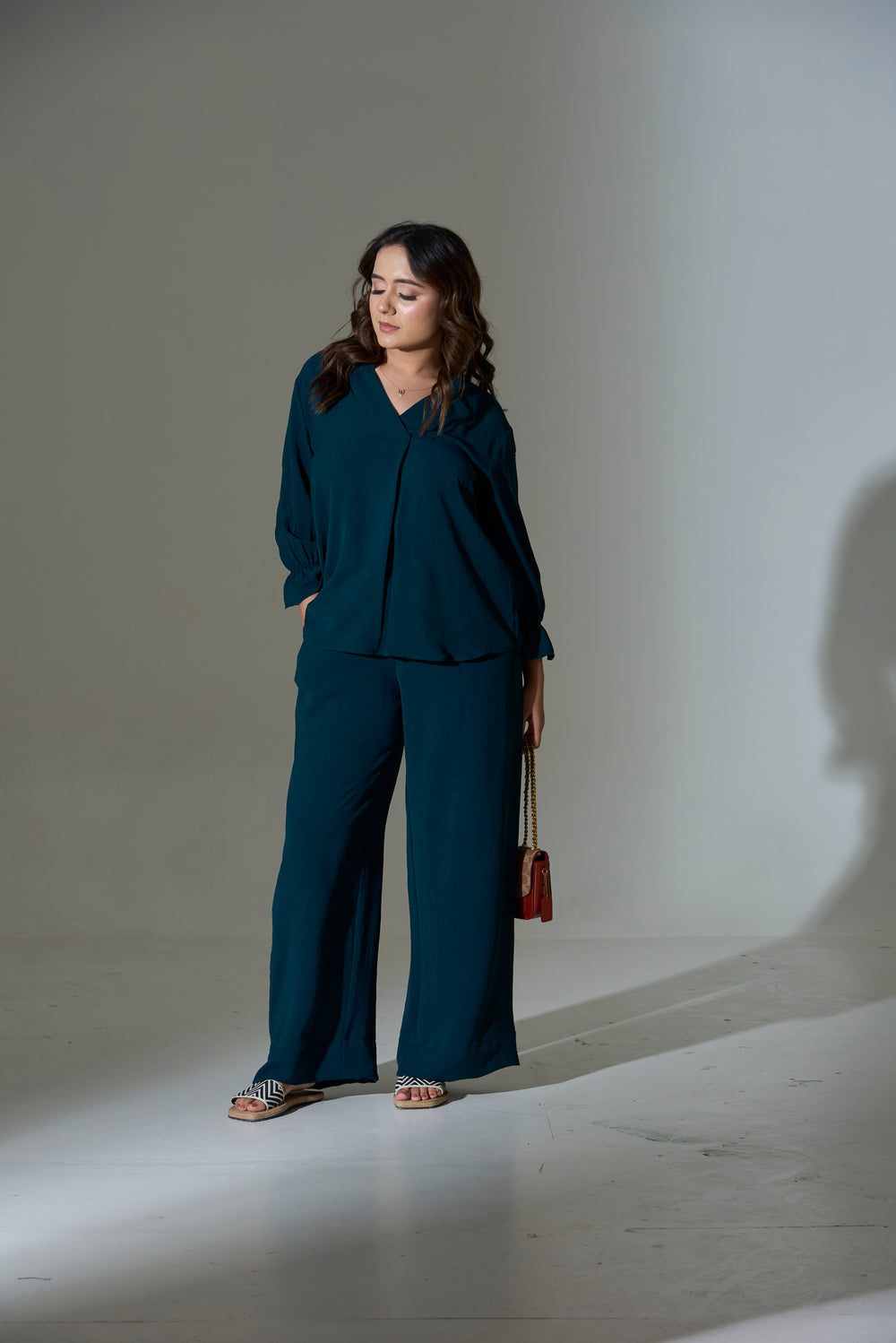 Elegant burnt orange crepe coord set styled with relaxed fit top and wide-leg pants