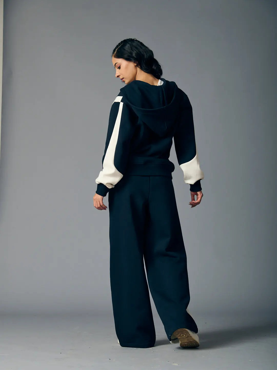 Risate chic streetwear set for women featuring a black hoodie and wide-leg pants