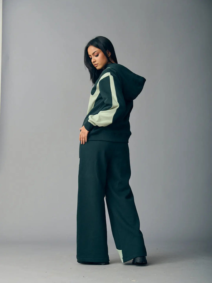 Risate chic streetwear set for women featuring a stylish hoodie and wide-leg pants in dark tones