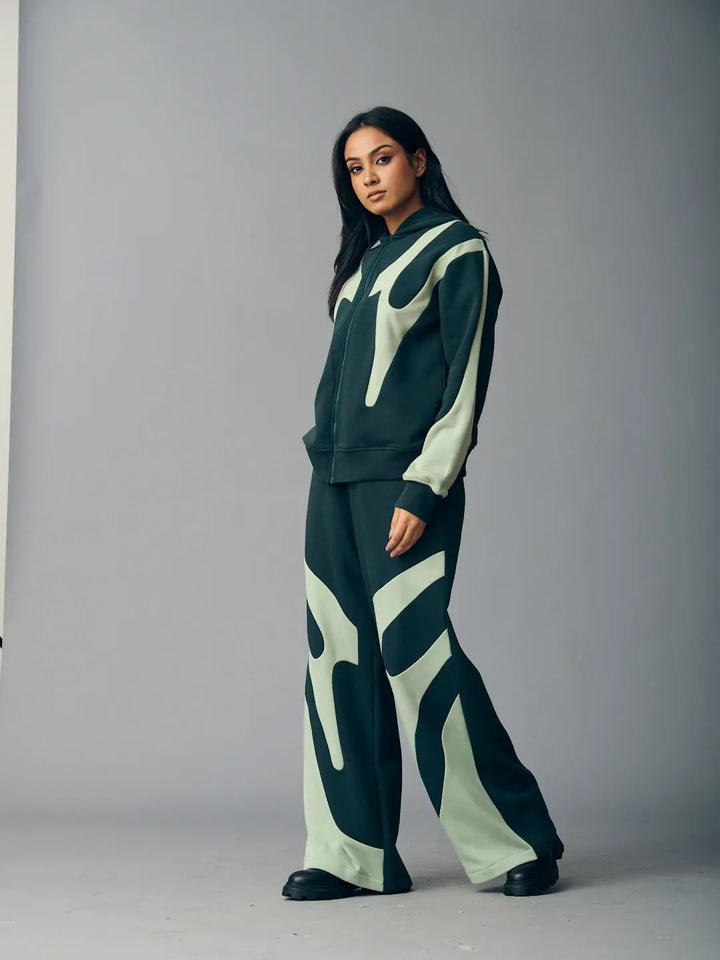 Risate chic streetwear set for women in black and green featuring a stylish hoodie and wide-leg pants