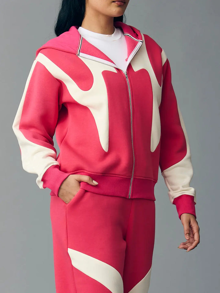 Risate chic streetwear set for women featuring a stylish pink and cream zip-up hoodie and matching pants