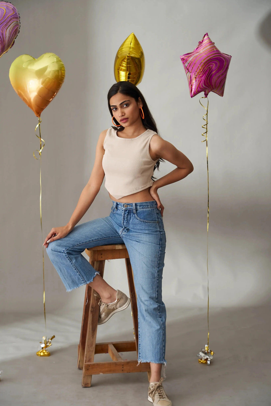 Clover crop top for women in beige paired with high-waisted blue jeans, styled for a casual look