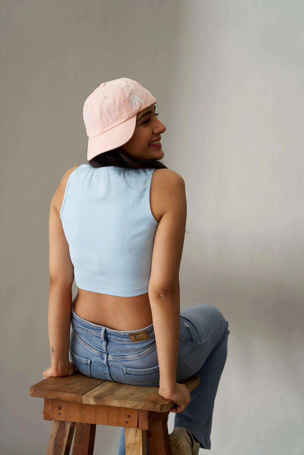 Casual blue clover crop top for women, perfect for summer outfits and paired with jeans