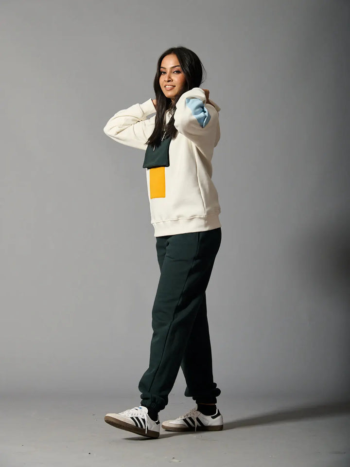 Risate color block hoodie for women in cream with vibrant color accents, styled with matching joggers