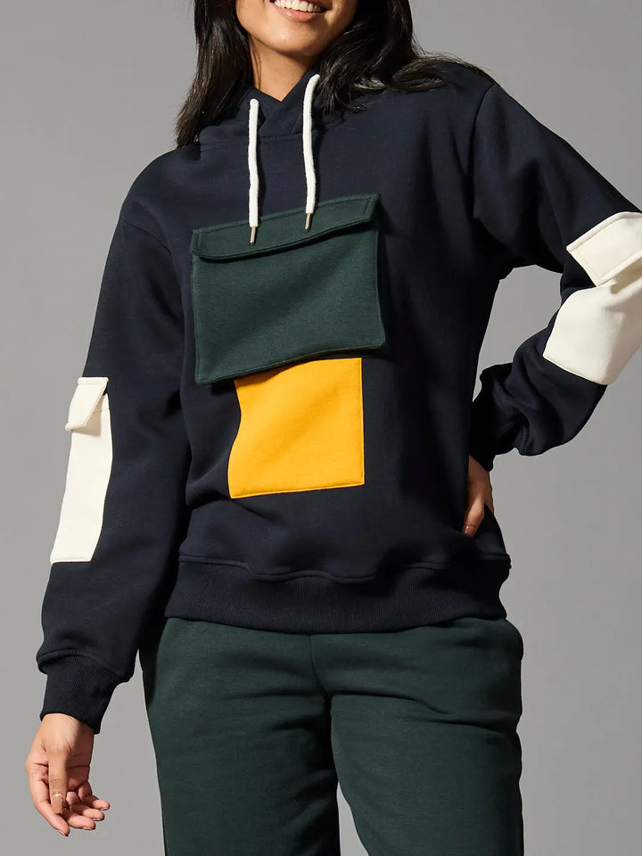 Risate color block hoodie for women featuring vibrant patches and a cozy fit