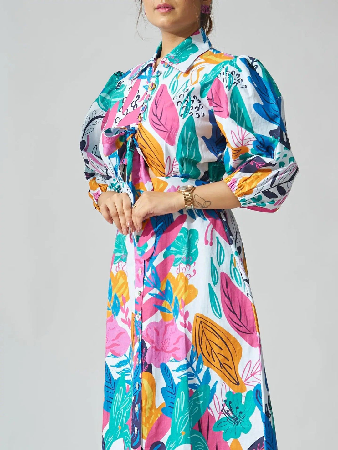 Risate coral reef print linen midi dress featuring vibrant floral patterns and puff sleeves