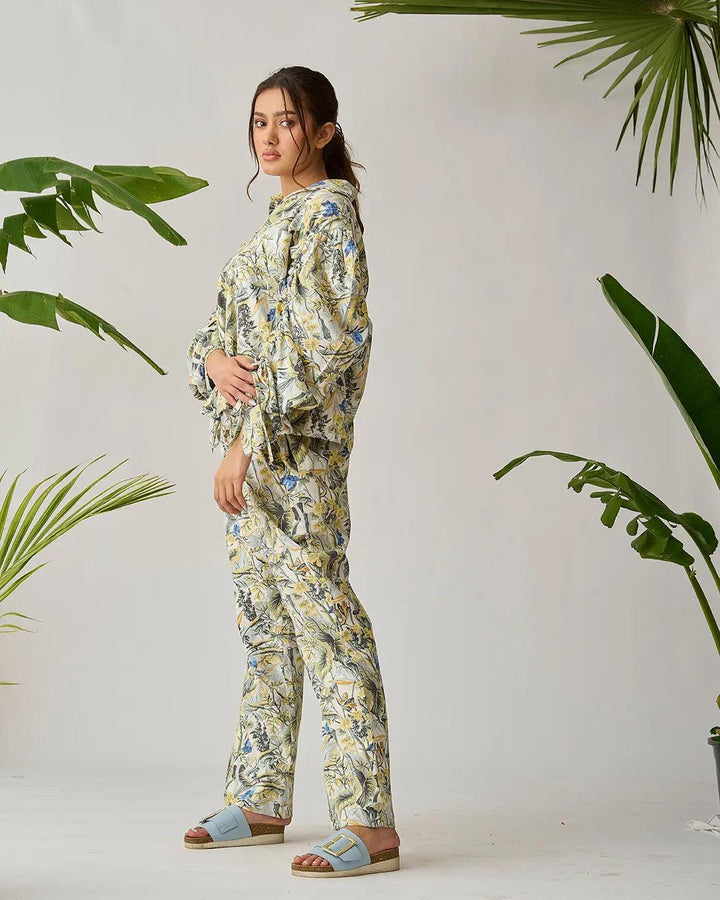 Risate cotton bed linen set in floral print, featuring a coordinated top and pants in light colors