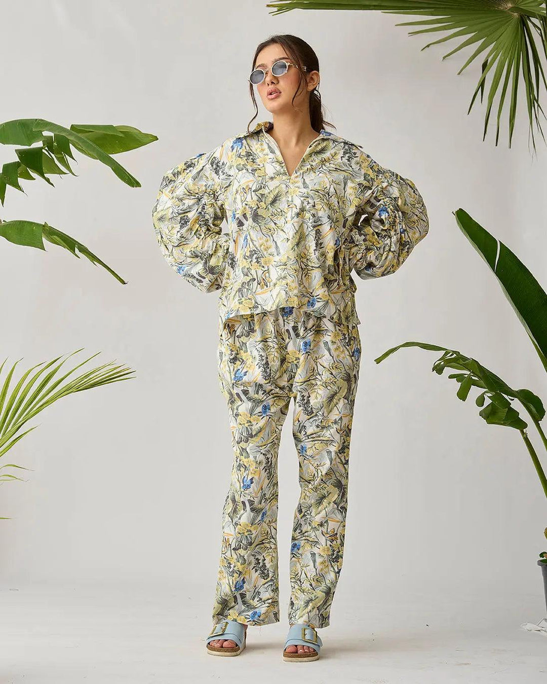 Risate cotton bed linen set in floral print, featuring a long-sleeve top and matching pants, styled with bold sleeves