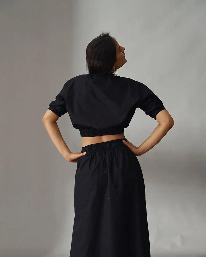 Black cotton poplin co-ord set for women featuring a cropped top and high-waisted skirt