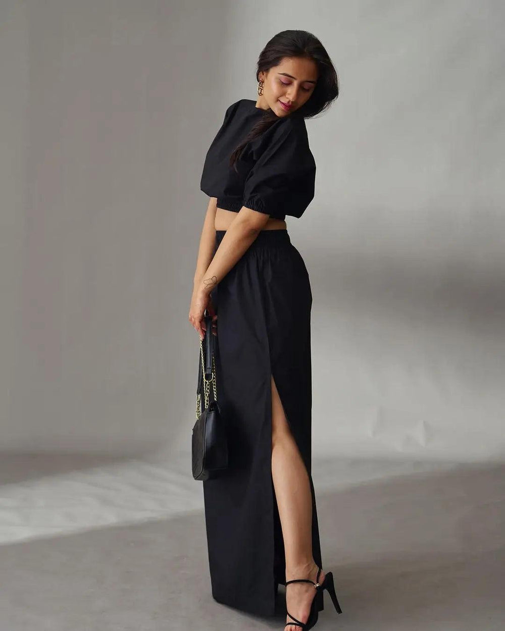 Stylish black cotton poplin co-ord set for women, featuring a cropped top and long skirt with a thigh slit