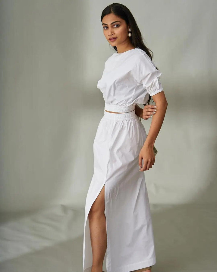 Elegant Risate cotton poplin co-ord set for women in white featuring a cropped top and high-slit skirt