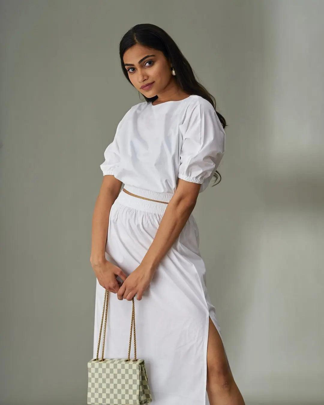 Risate cotton poplin co-ord set for women, featuring a puff-sleeve top and thigh-slit skirt in white