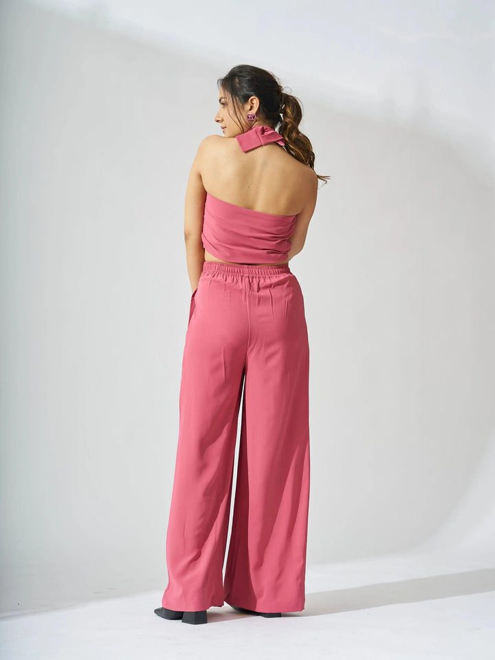 Back view of a pink cross neck cropped waistcoat set with wide-leg pants for summer style