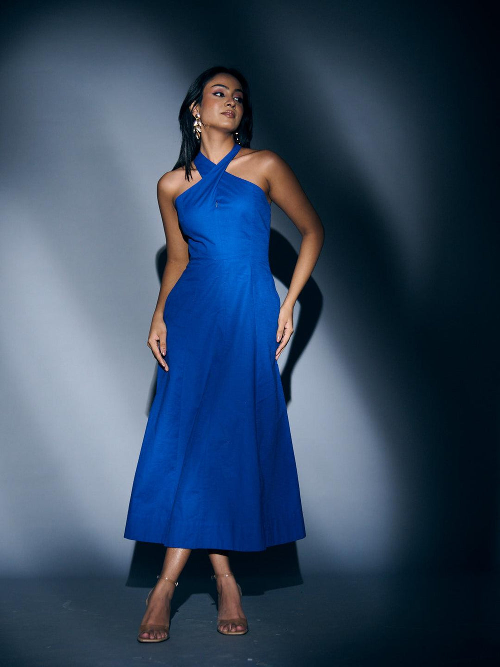 Risate crossneck linen maxi dress in vibrant blue with a modern halter design for stylish occasions
