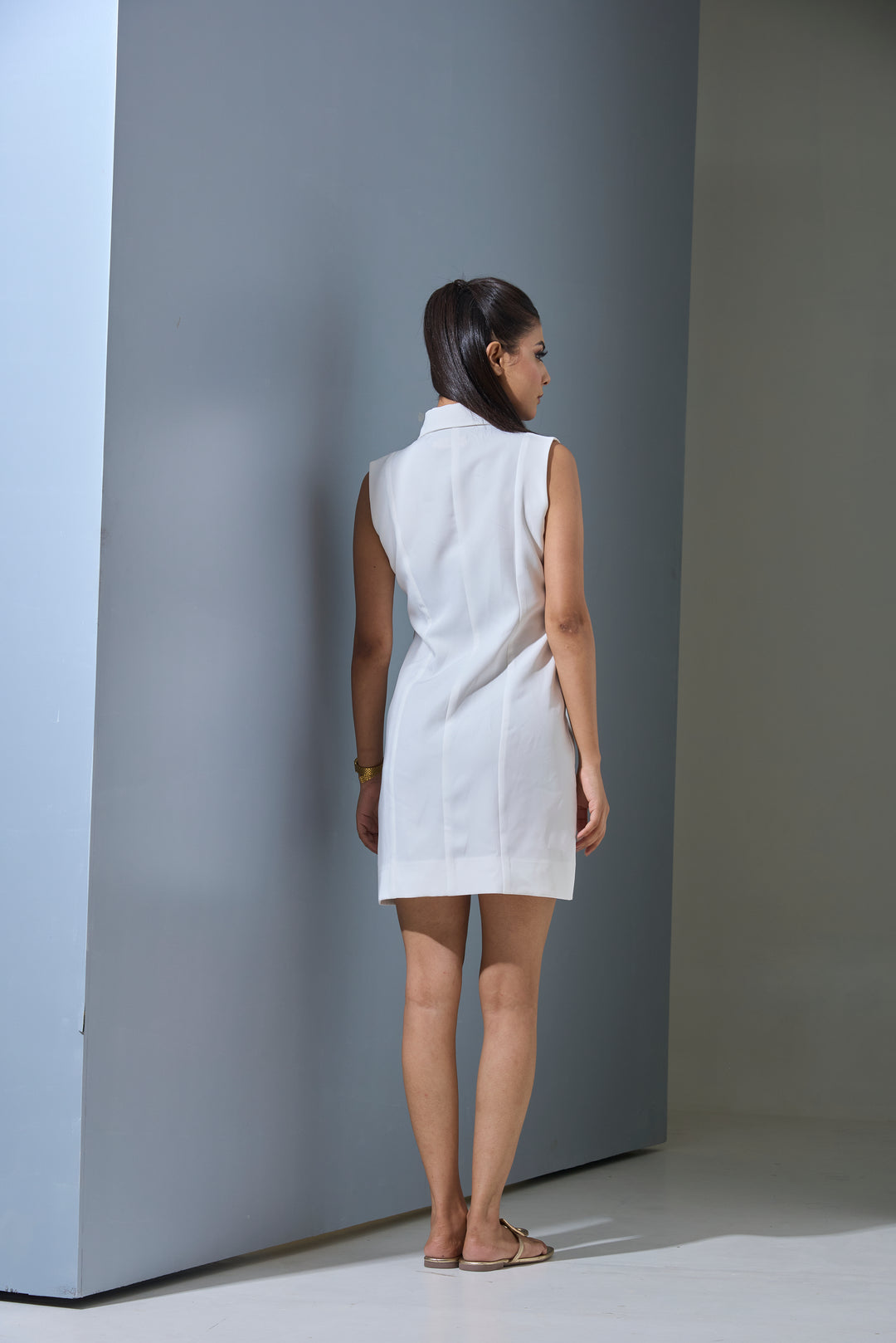 Back view of the Elara white mini dress by Risate, showcasing a sleek, sleeveless design