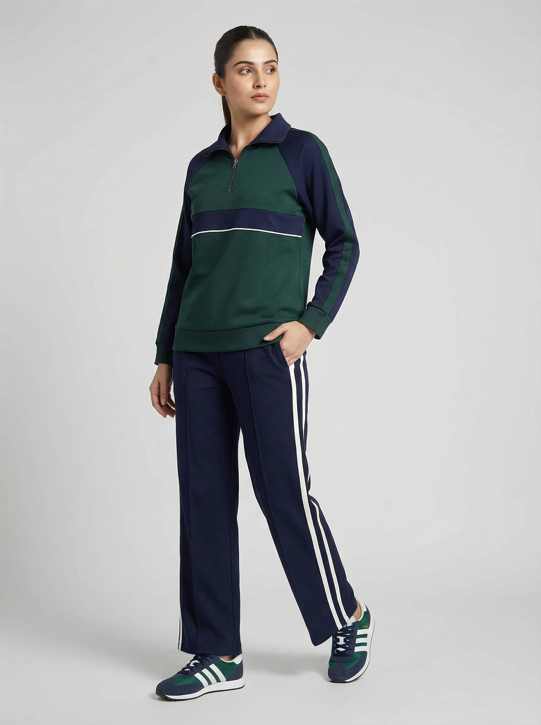 Emerald navy luxe trackset for women featuring a zip-up top and striped pants from Risate