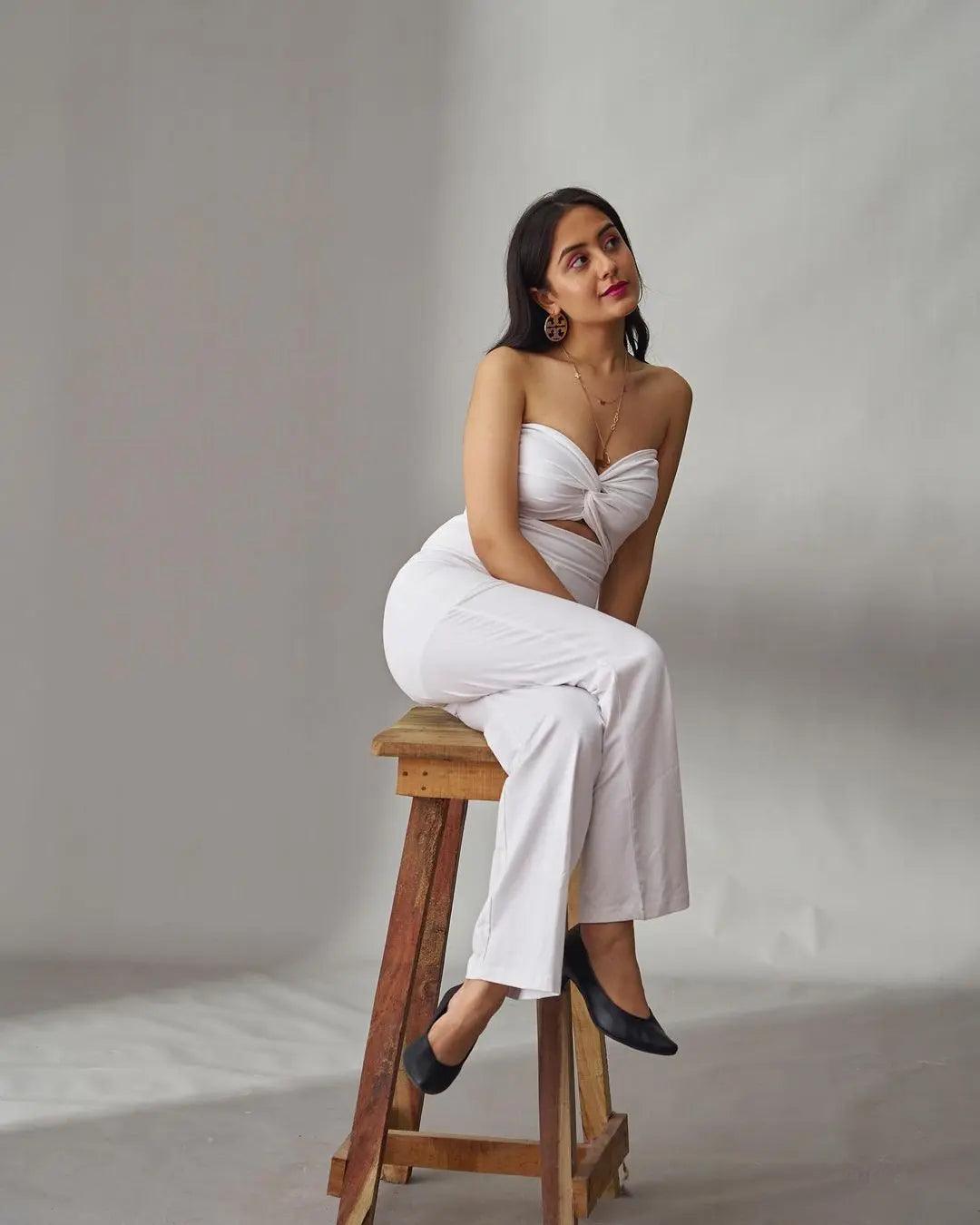Elegant front knot off shoulder jumpsuit in white, featuring a stylish design and flared legs