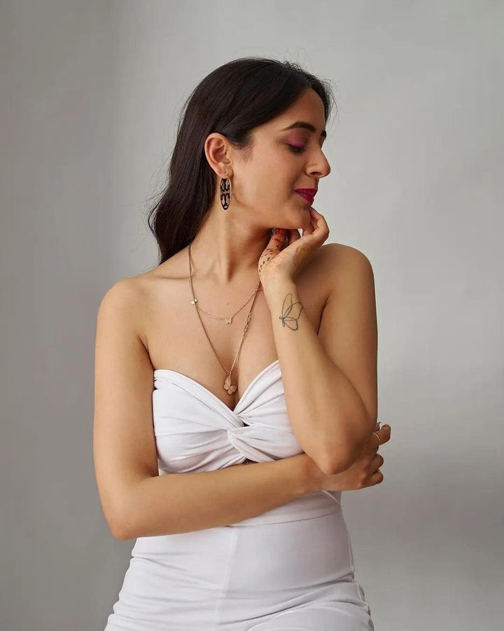 Elegant Risate front knot off shoulder jumpsuit in white, perfect for stylish summer outings