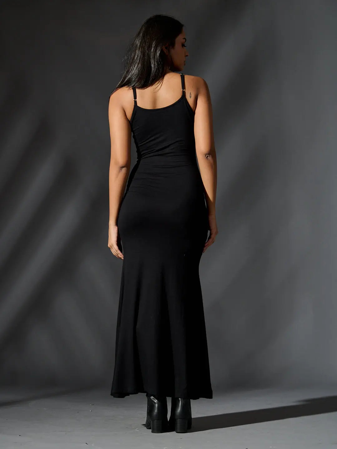 Back view of a sleek black glam maxi bodycon dress with thin adjustable straps