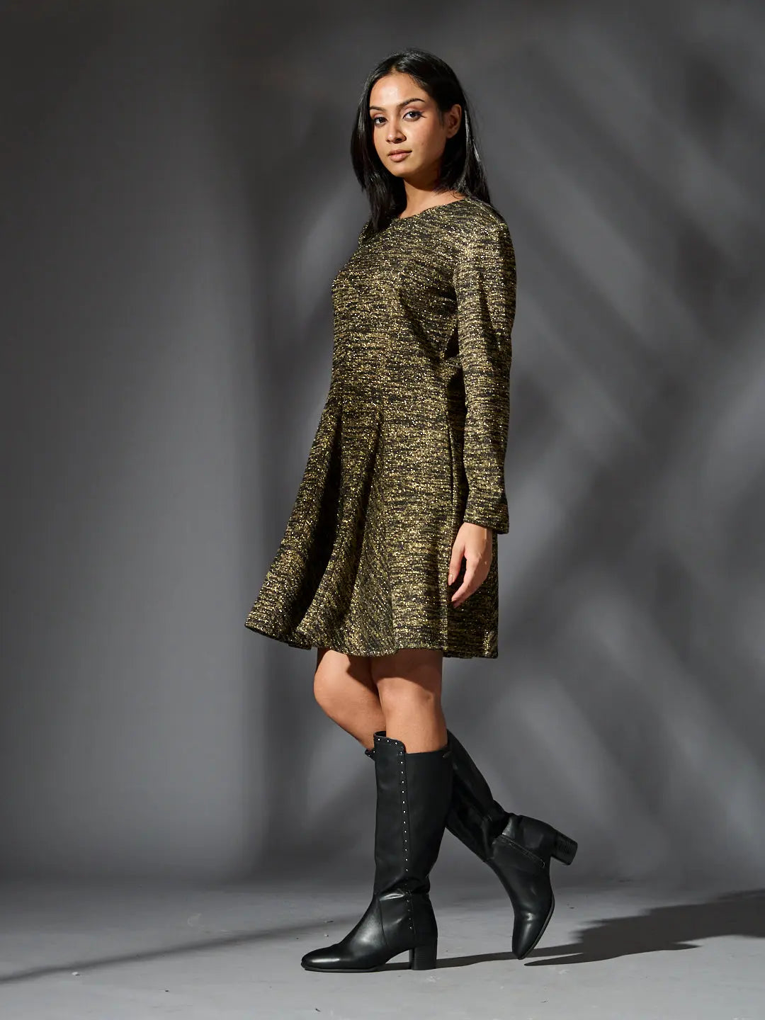 Risate golden knit glam dress featuring a flared skirt and long sleeves, perfect for stylish occasions