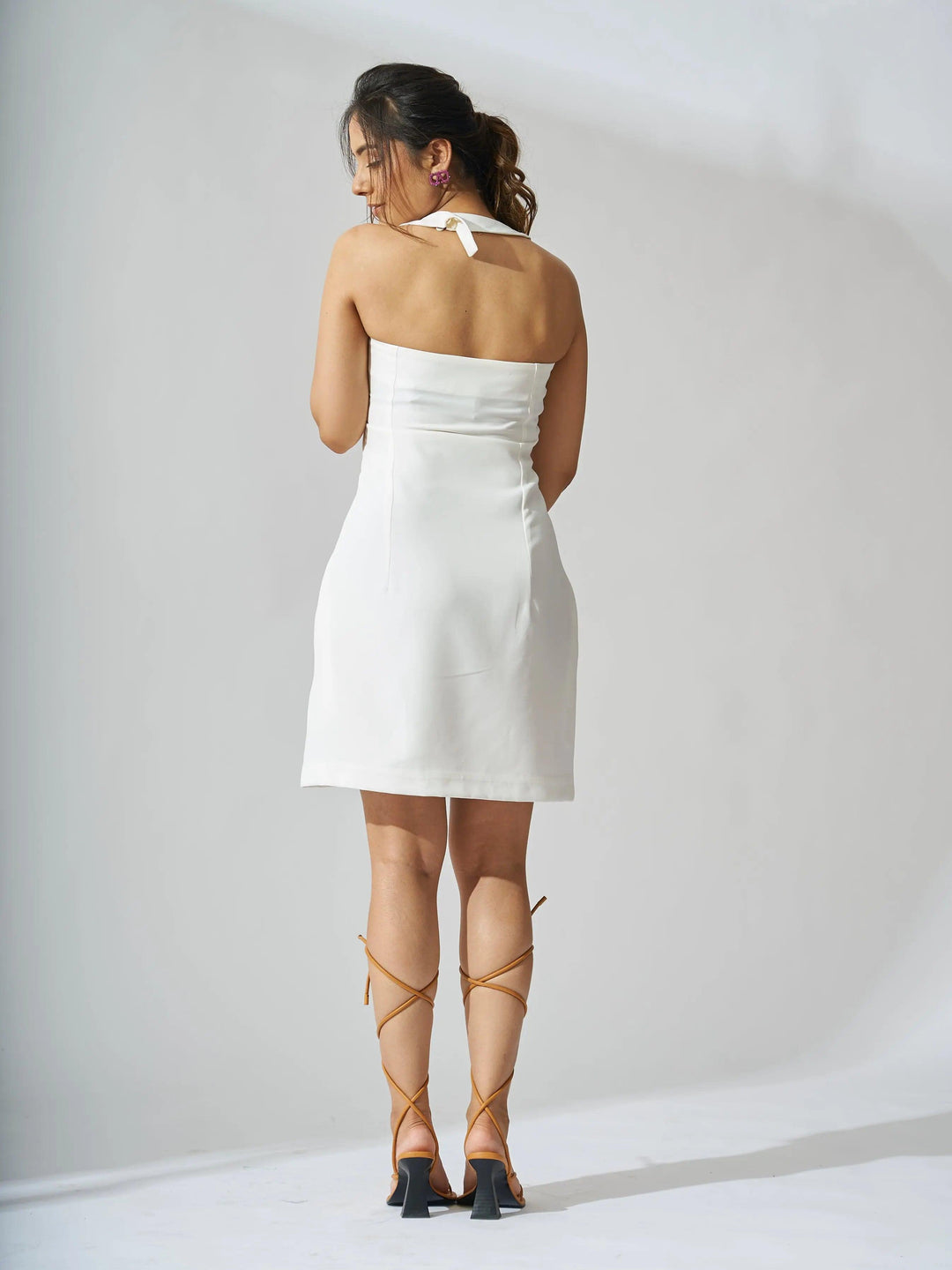 Back view of Risate halterneck crepe mini dress in white, perfect for summer outings and parties