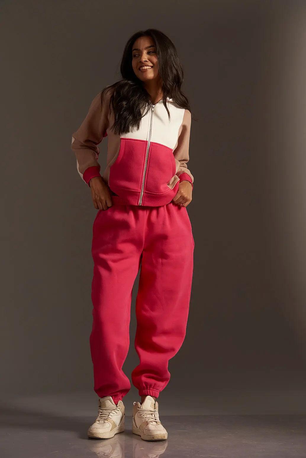 Pink and beige hooded sweatshirt zip up featuring a color-block design, styled with matching joggers