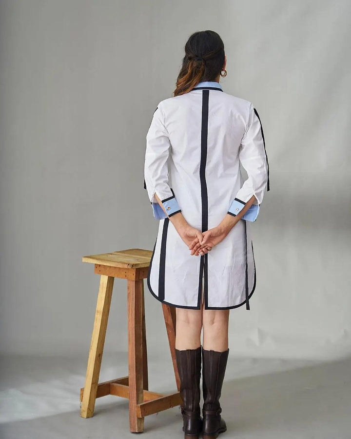 Back view of a Risate Impressionist cotton shirt dress with tailored design and contrasting details