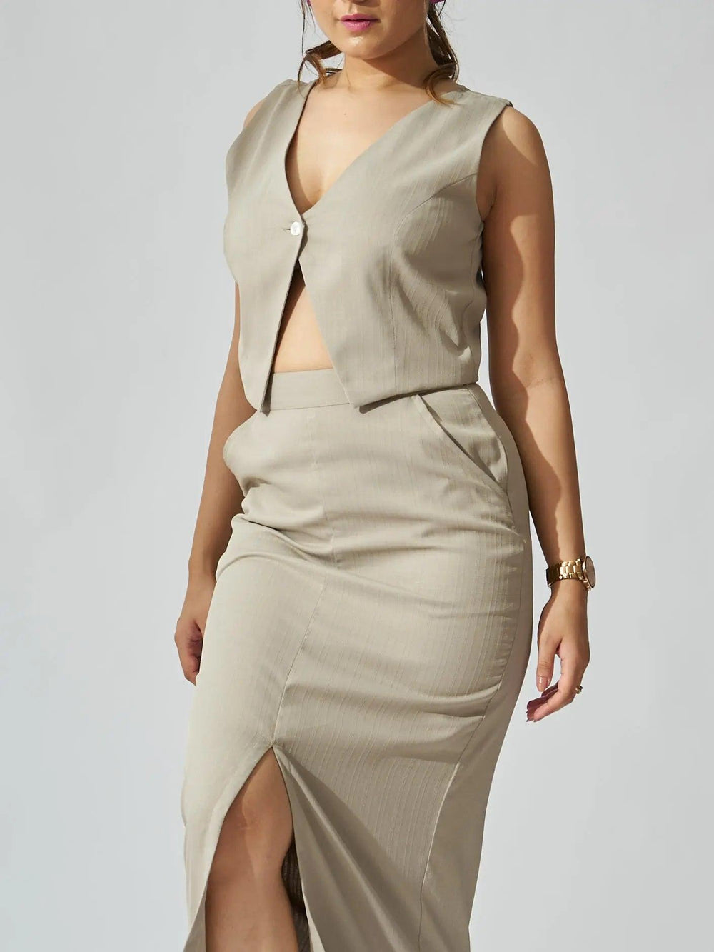 Elegant ivory cutout co-ord set for women featuring a stylish cropped top and a high-slit skirt