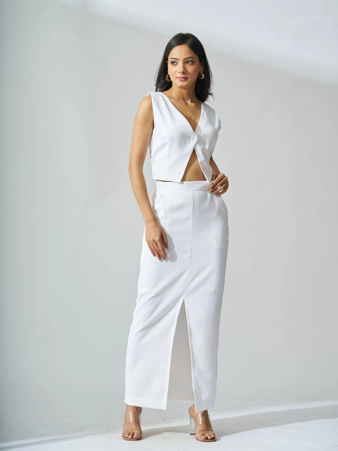 Ivory cutout co-ord set for women featuring a sleeveless top and a stylish skirt with a slit