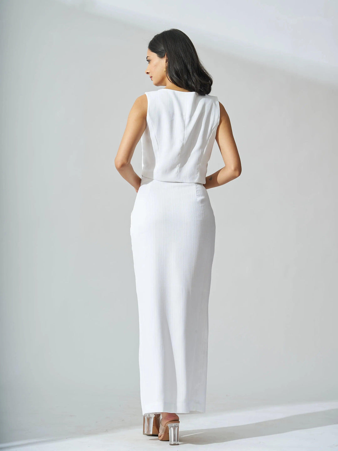 Elegant ivory cutout co-ord set for women featuring a sleek fitted design and stylish back view