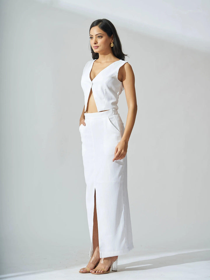 Elegant ivory cutout co-ord set for women featuring a stylish top and a high-slit skirt