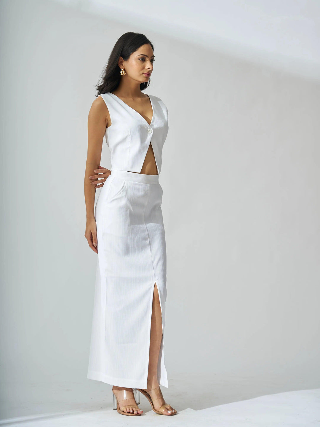 Ivory cutout co-ord set for women featuring a sleeveless top and a high-slit skirt