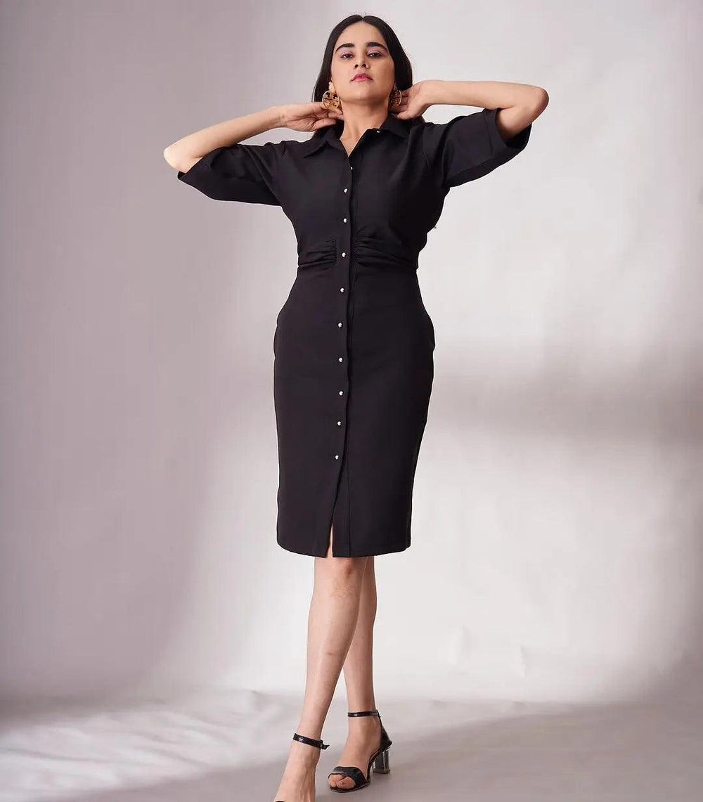 Elegant black knee length dress for women with button details and stylish puff sleeves