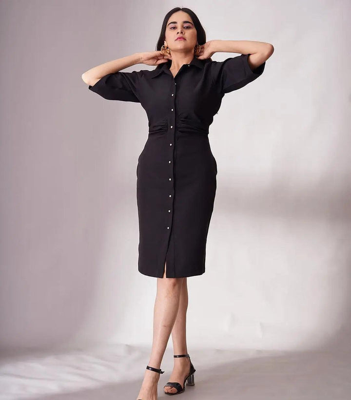 Elegant black knee length dress for women with button details and stylish puff sleeves
