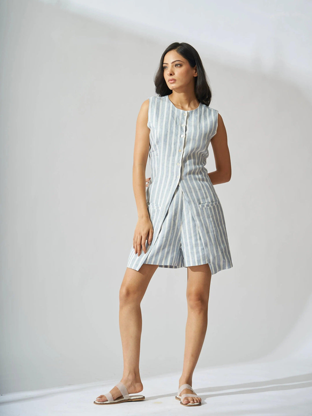Elegant Risate linen striped vest and shorts set in blue and white with a button front design