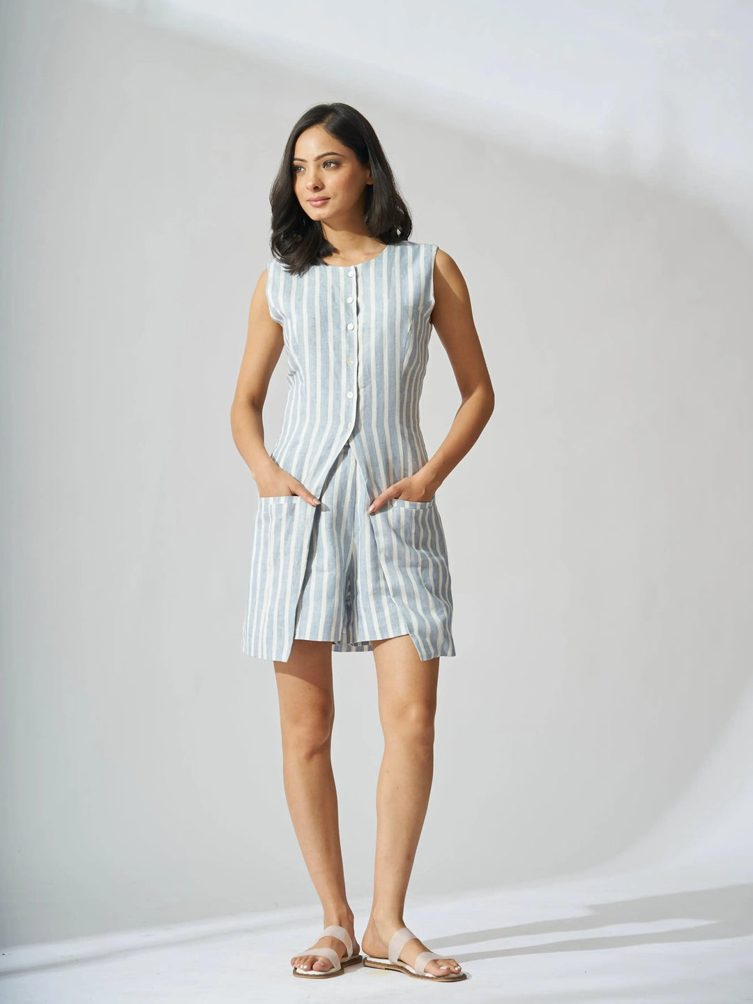 Front view of a Risate linen vest and shorts set for women in blue and white stripes, featuring pockets