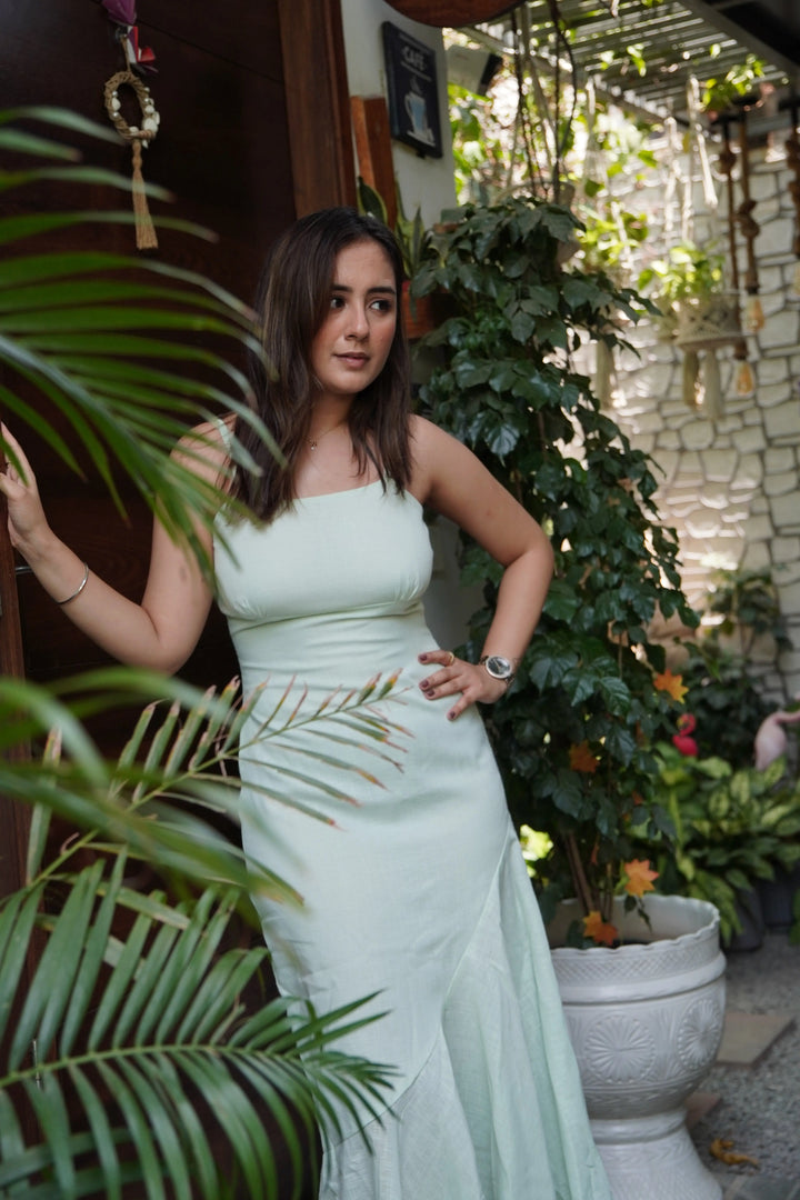 Mint green western dress from Risate, featuring a stylish fitted design in a natural setting