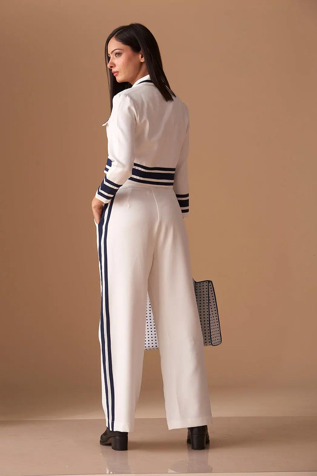 Back view of a white Risate blazer with navy stripes, ideal for stylish layering in casual outfits.