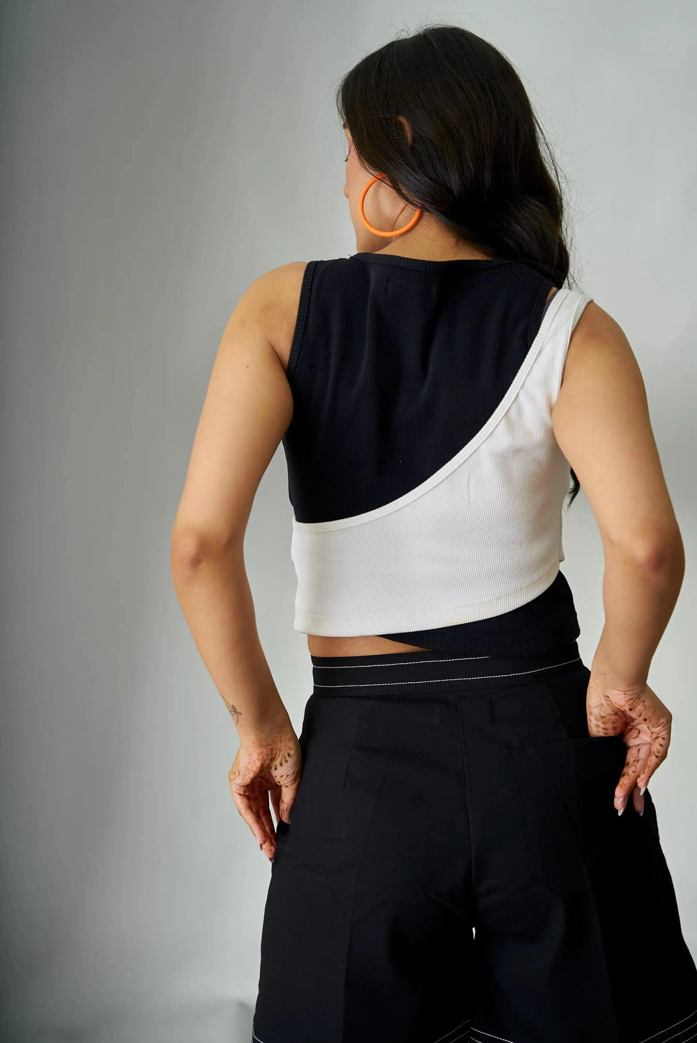Olivia crop top for women in black and white with a unique asymmetrical design