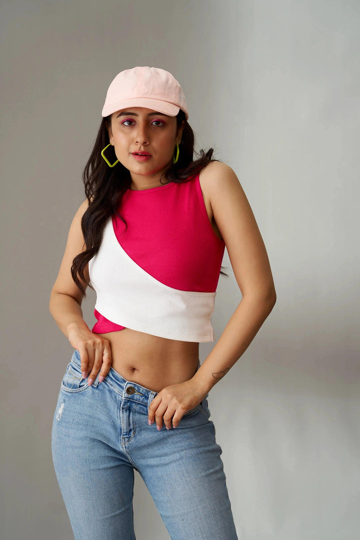 Trendy Olivia crop top for women in pink and white design, paired with blue jeans and a cap