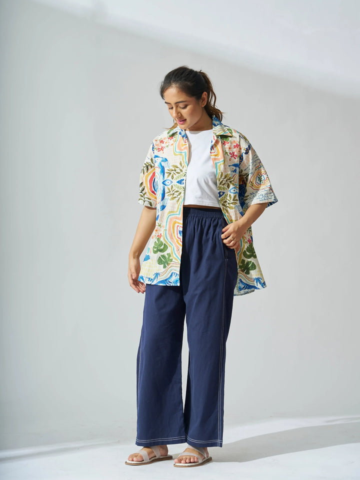 Colorful oversized cotton poplin shirt for women styled with casual pants and sandals
